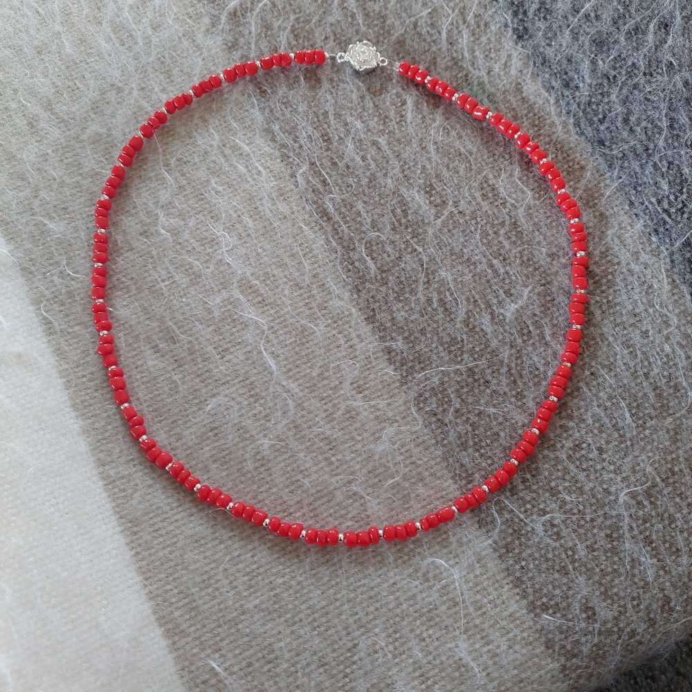 Handmade red beaded necklace with silver spacers and 925 silver clasp